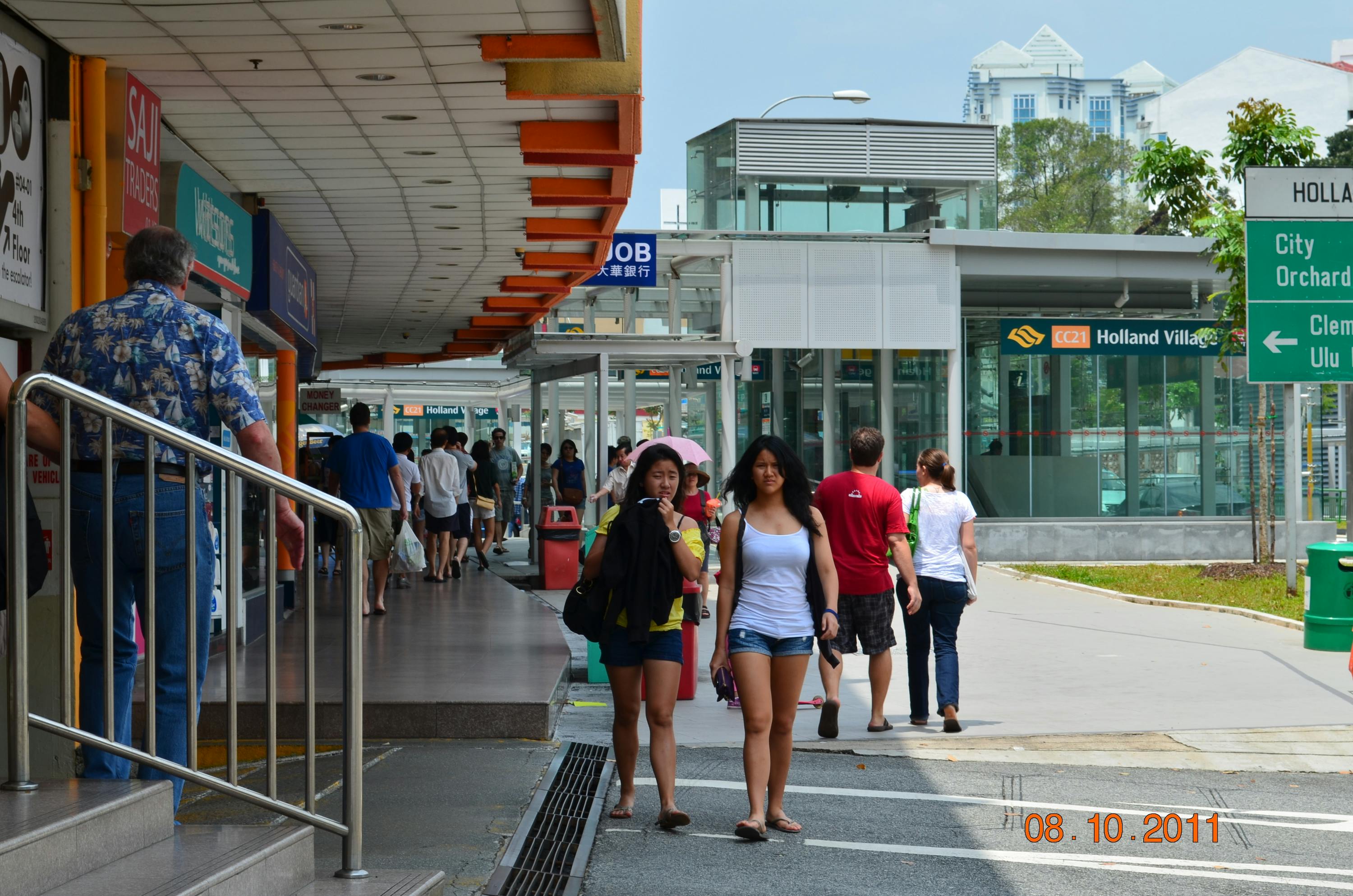 Holland Village MRT and the area in front of it is a seven-minute walk from 15 Holland Hill