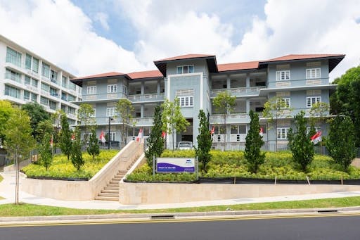 Painted blue and white, a front view of the House on the Hill Montessori School branch that sits atop Mount Sophia, within the same estate as Sophia Regency.