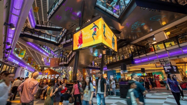 People file through the centre of Funan Mall