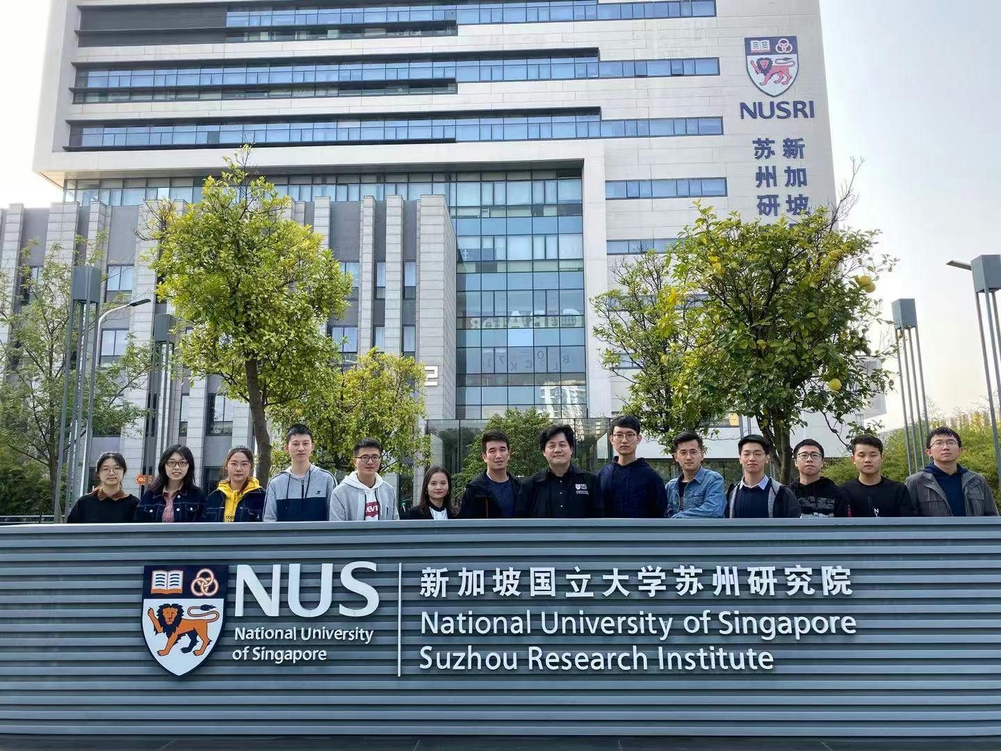 A group photo in front of the National University of Singapore (NUS)