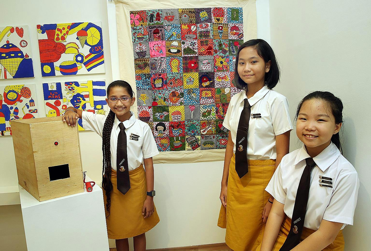 Students at Haig Girls' School posing beside a school project