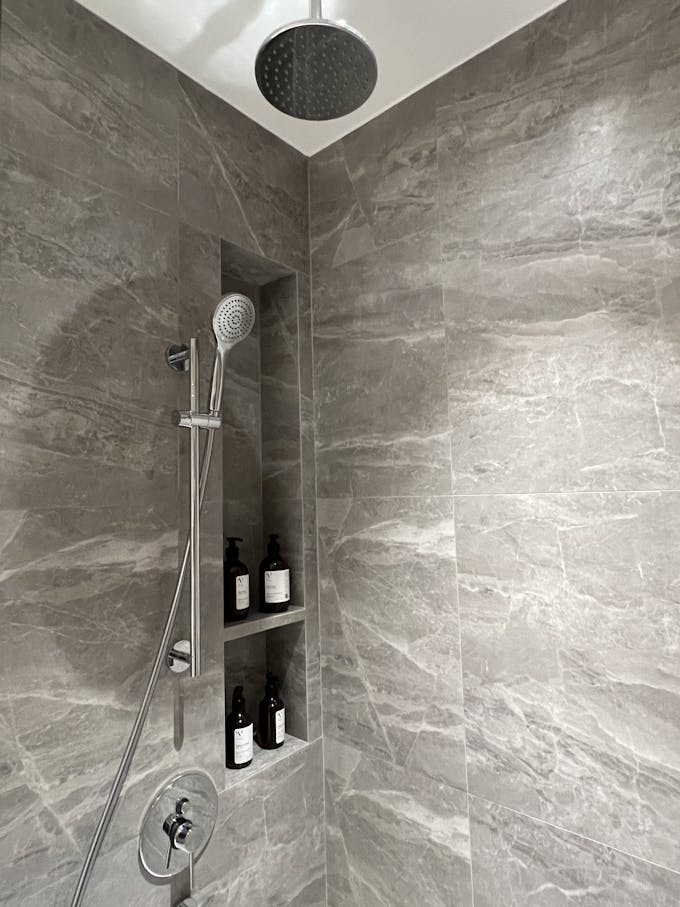 baywind residences 3 bedroom master bath rain shower and shelf