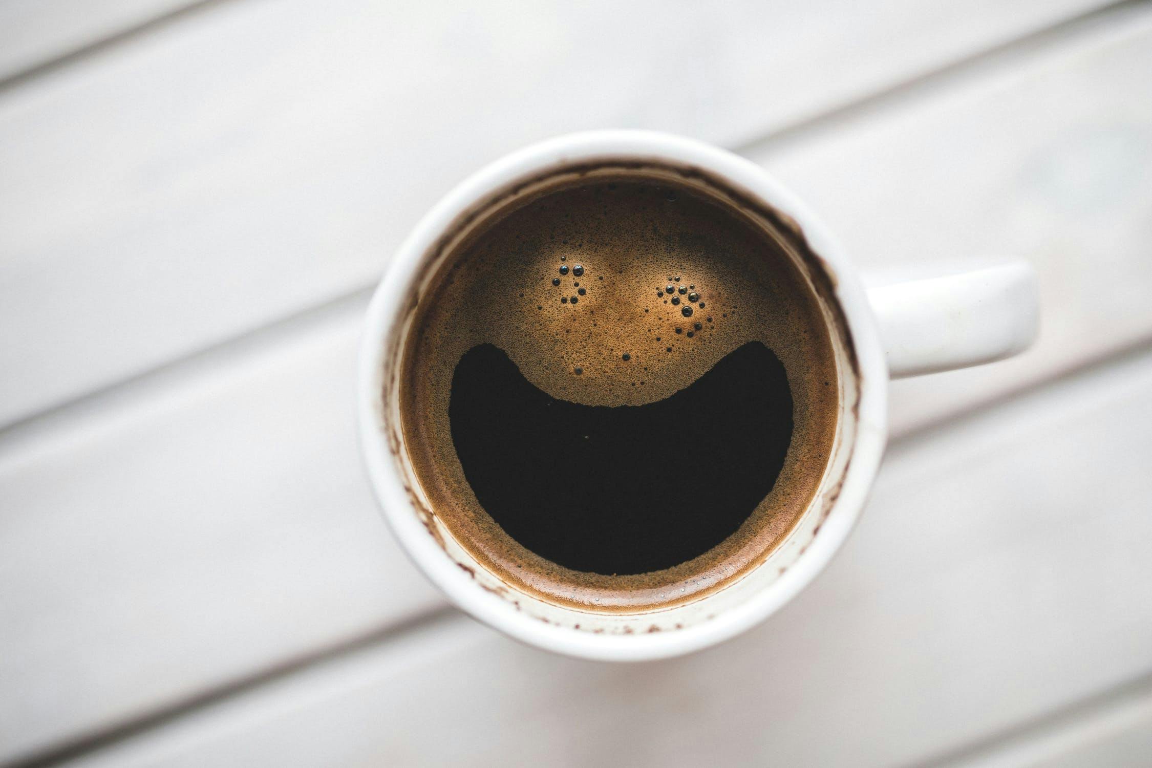 A cup of black coffee.