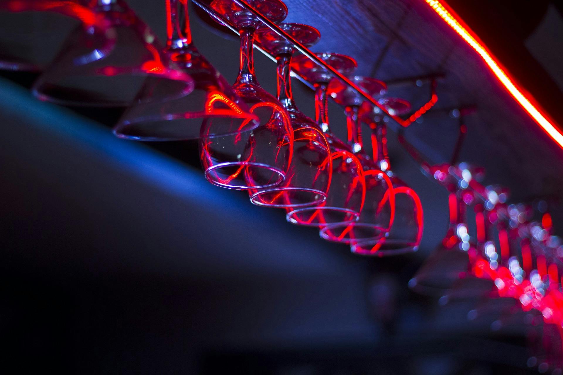 Wine glasses hanging overhead at a local bar