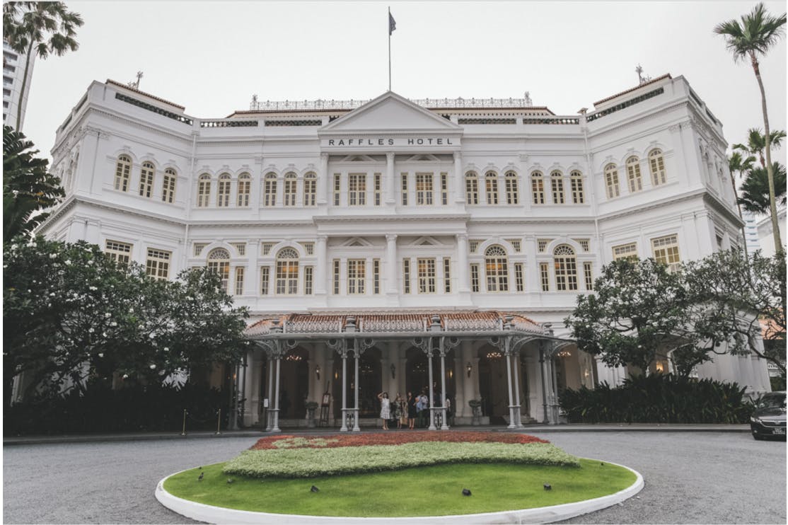 Raffles Hotel where you can enjoy a world famous Singapore Sling at the Long Bar