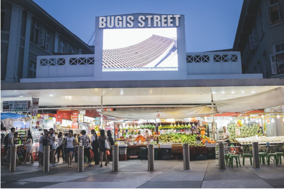 Popular shopping street in Singapore, Bugis Street, where all sorts of clothes store and snack stores open from morning till late in the night