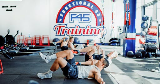 People do exercises lying down at the popular F45 training gym, with an outlet near Sophia Regency.