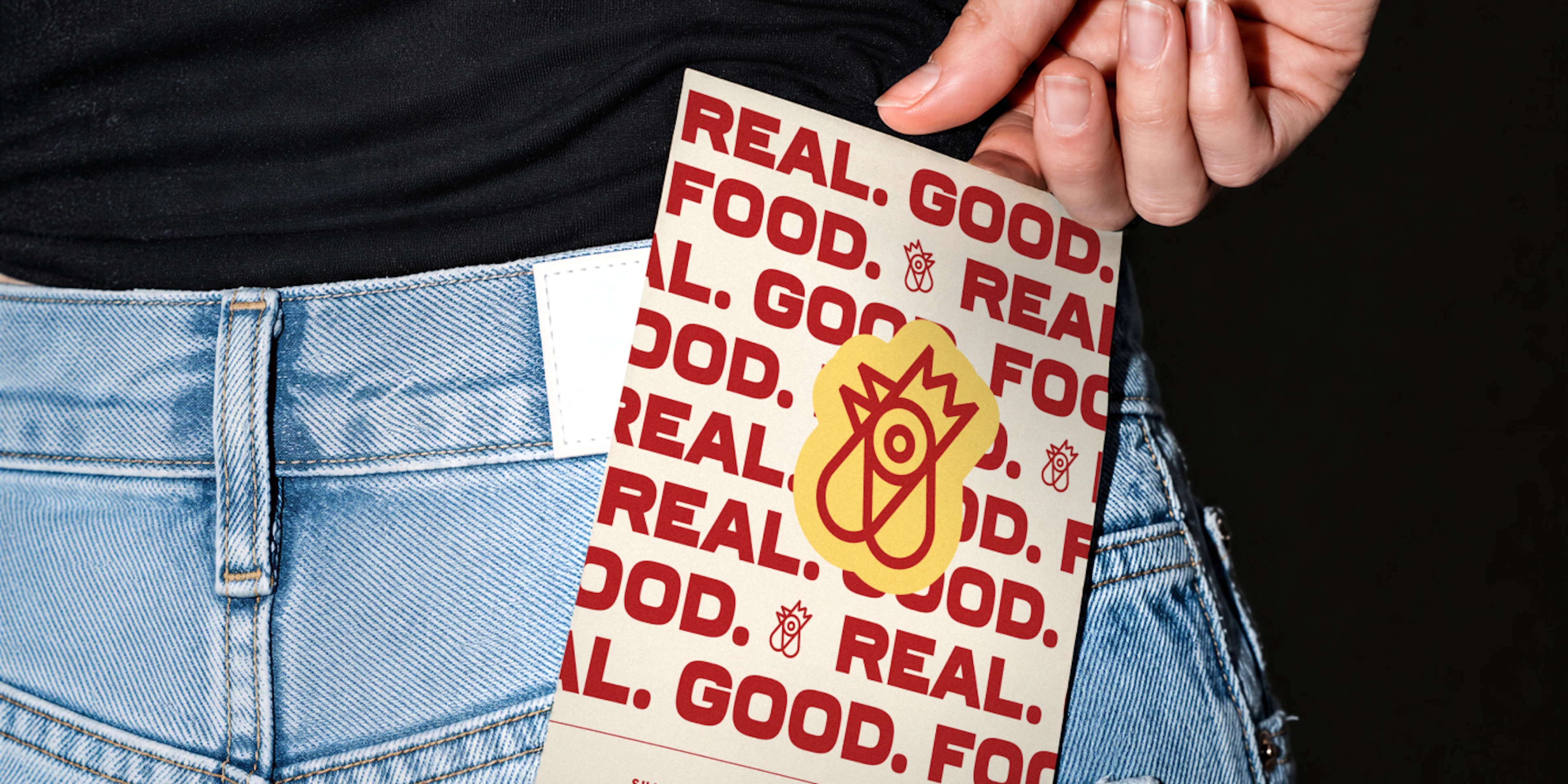 Restaurant menu in woman's back pocket of jeans