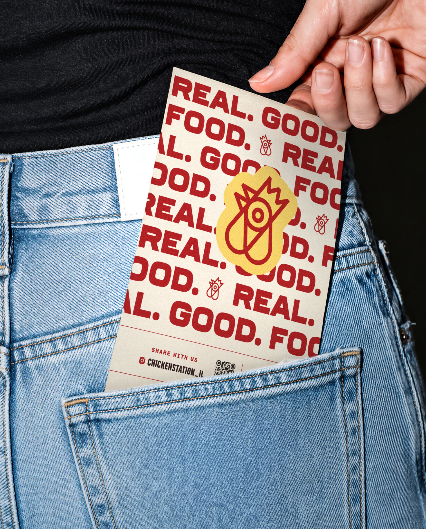 Restaurant menu in woman's back pocket of jeans
