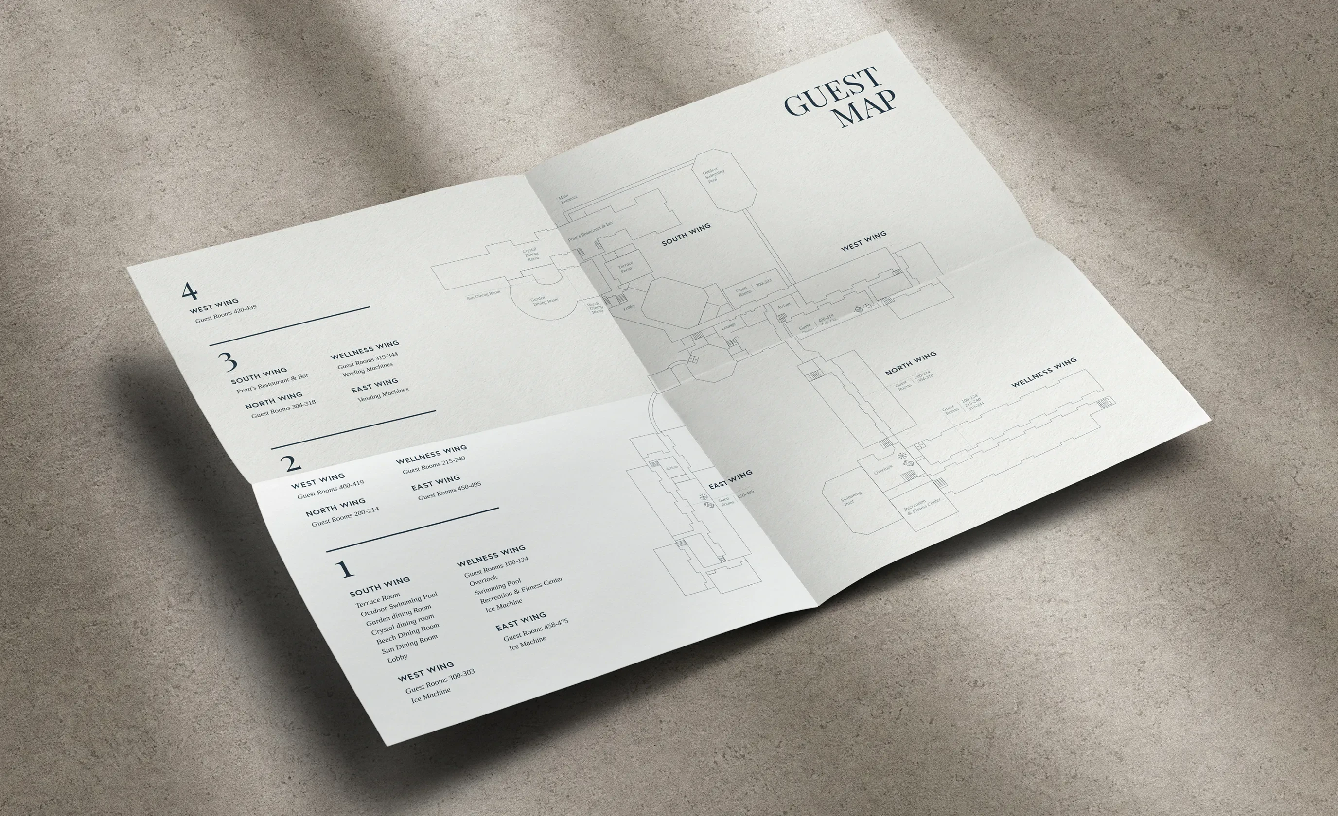 Folded paper guest map with hand-drawn illustrations