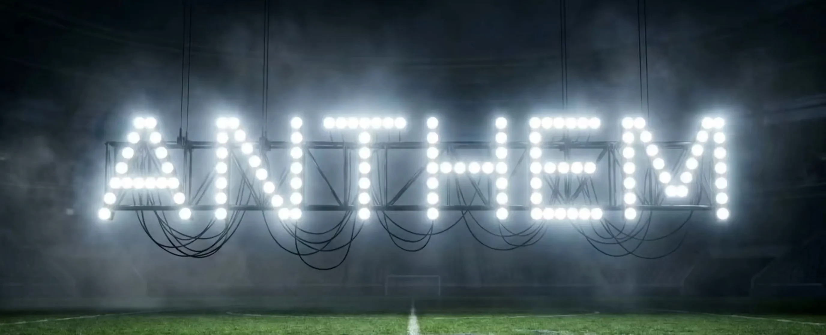 Illuminated Anthem marquee sign over a field at night