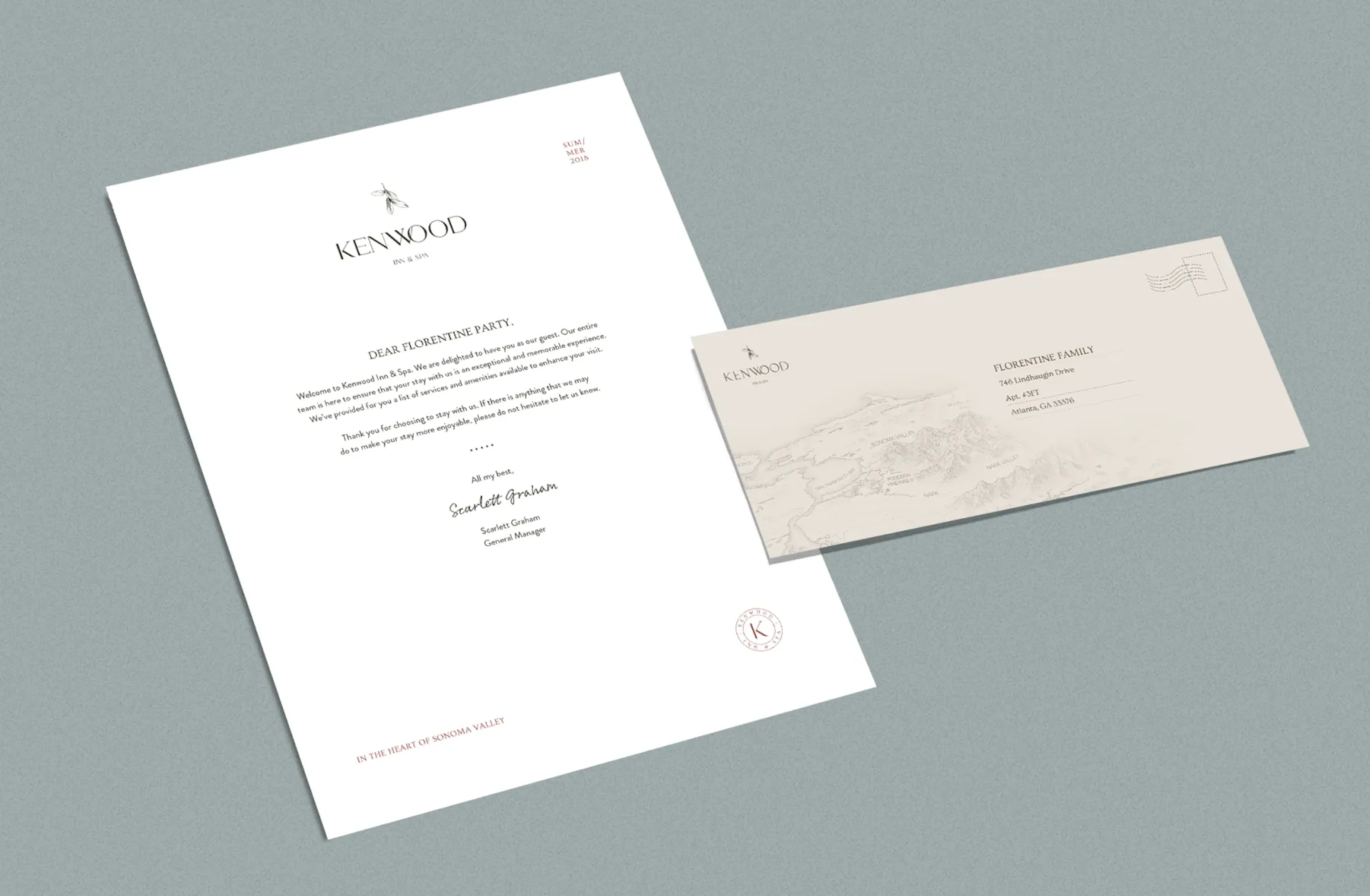 Kenwood letterhead and envelope mockup on grey-green background