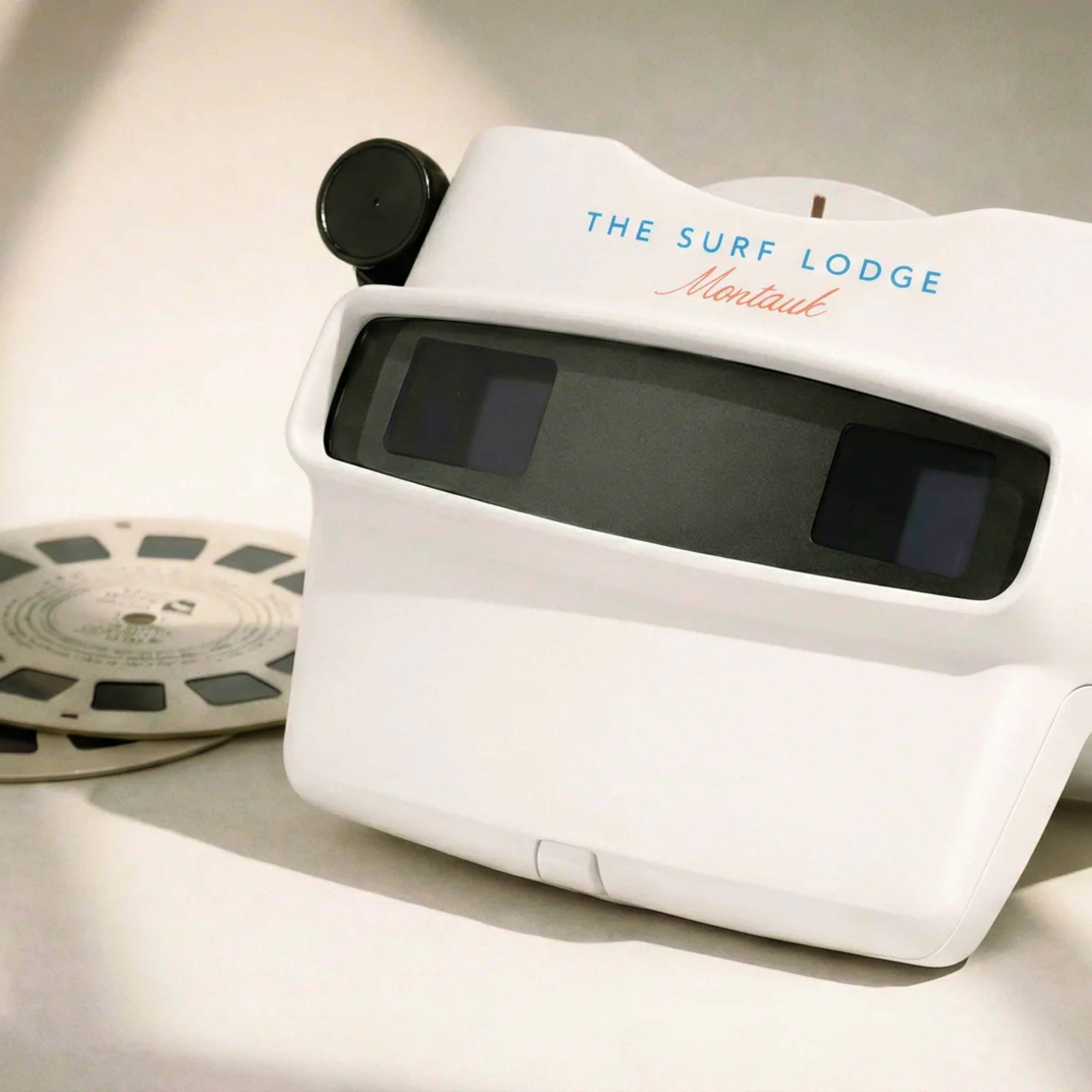 View-Master viewer reading The Surf Lodge Montauk, beside film reel