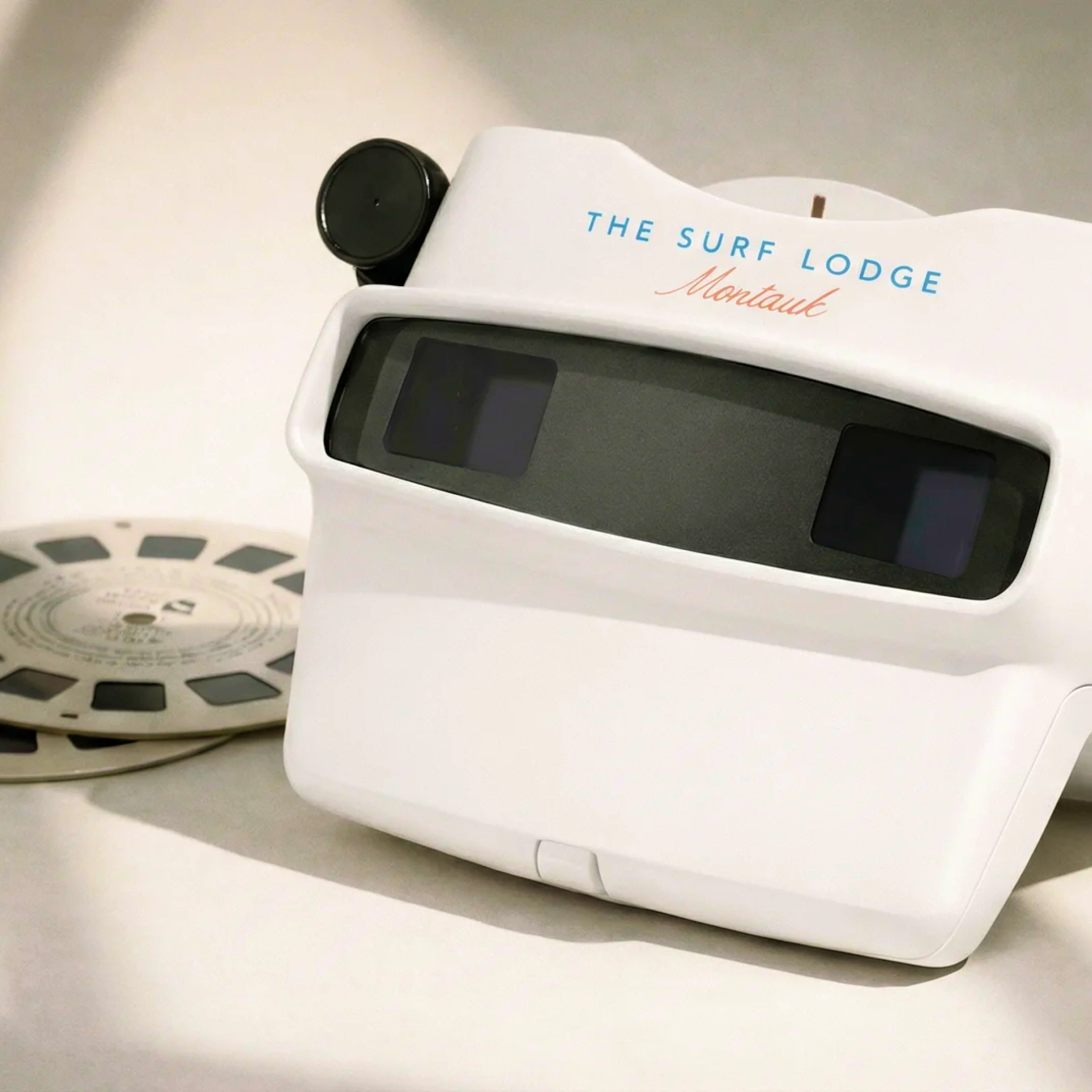 View-Master viewer reading The Surf Lodge Montauk, beside film reel
