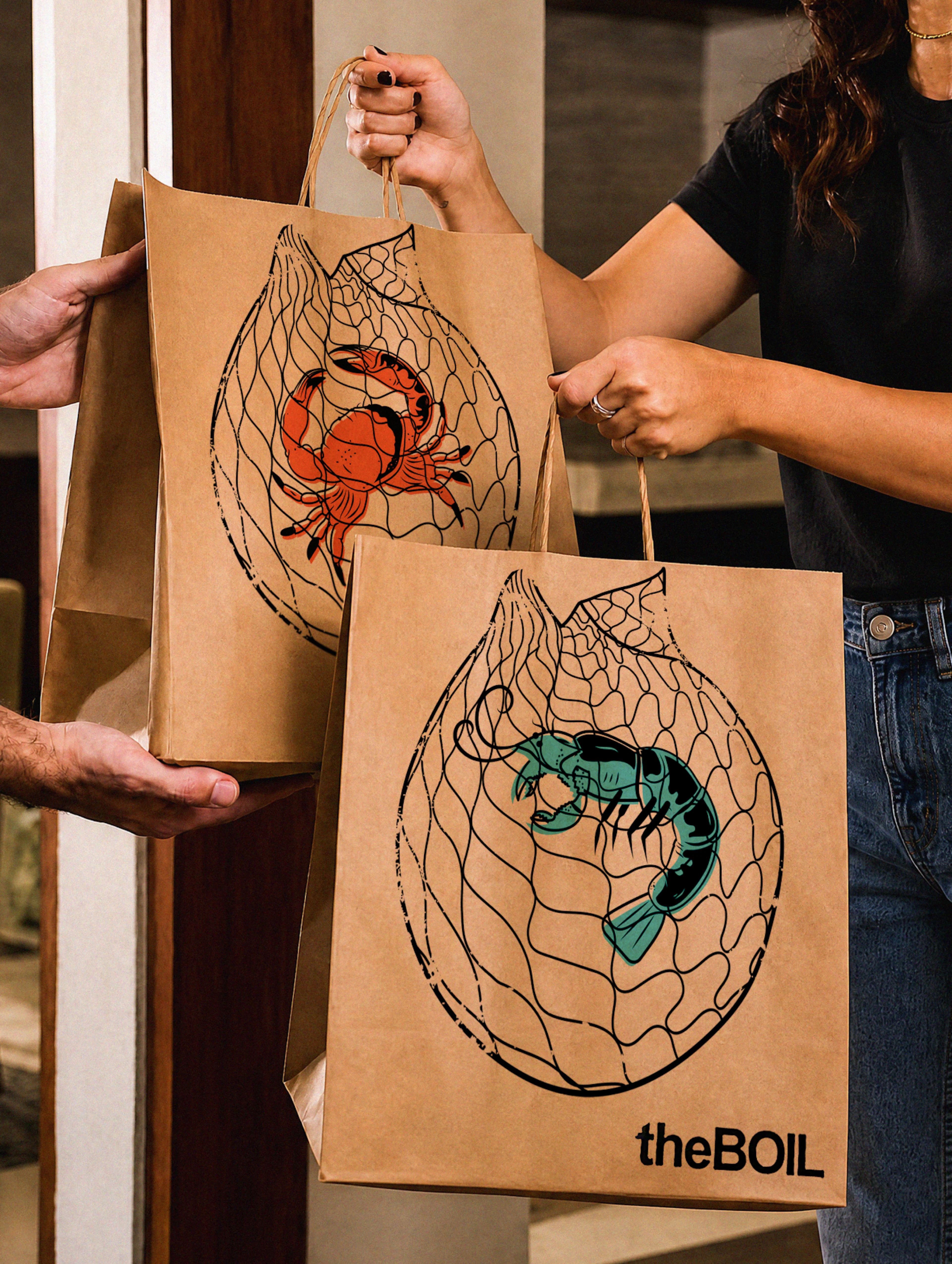 Person holding theBoil kraft paper takeout bags