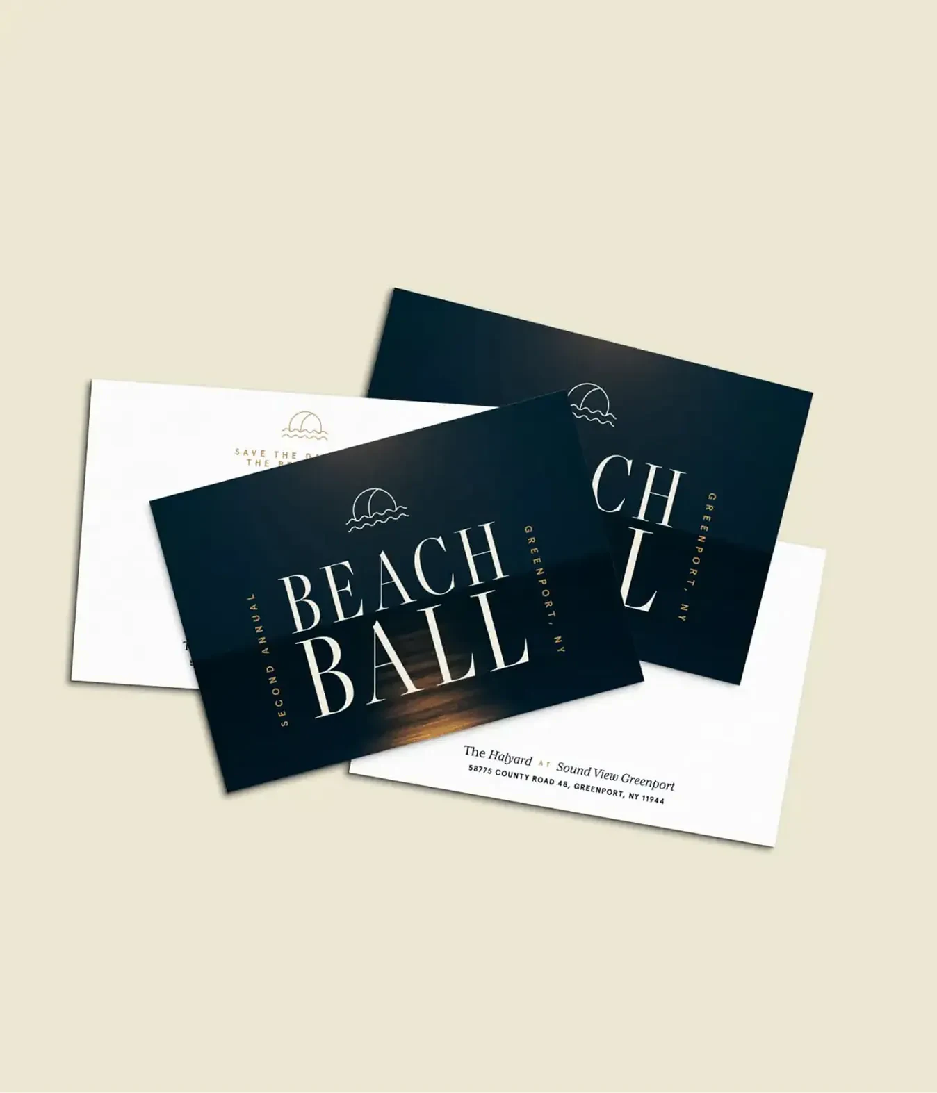 Beach Ball invitation and envelope cards fanned on a table