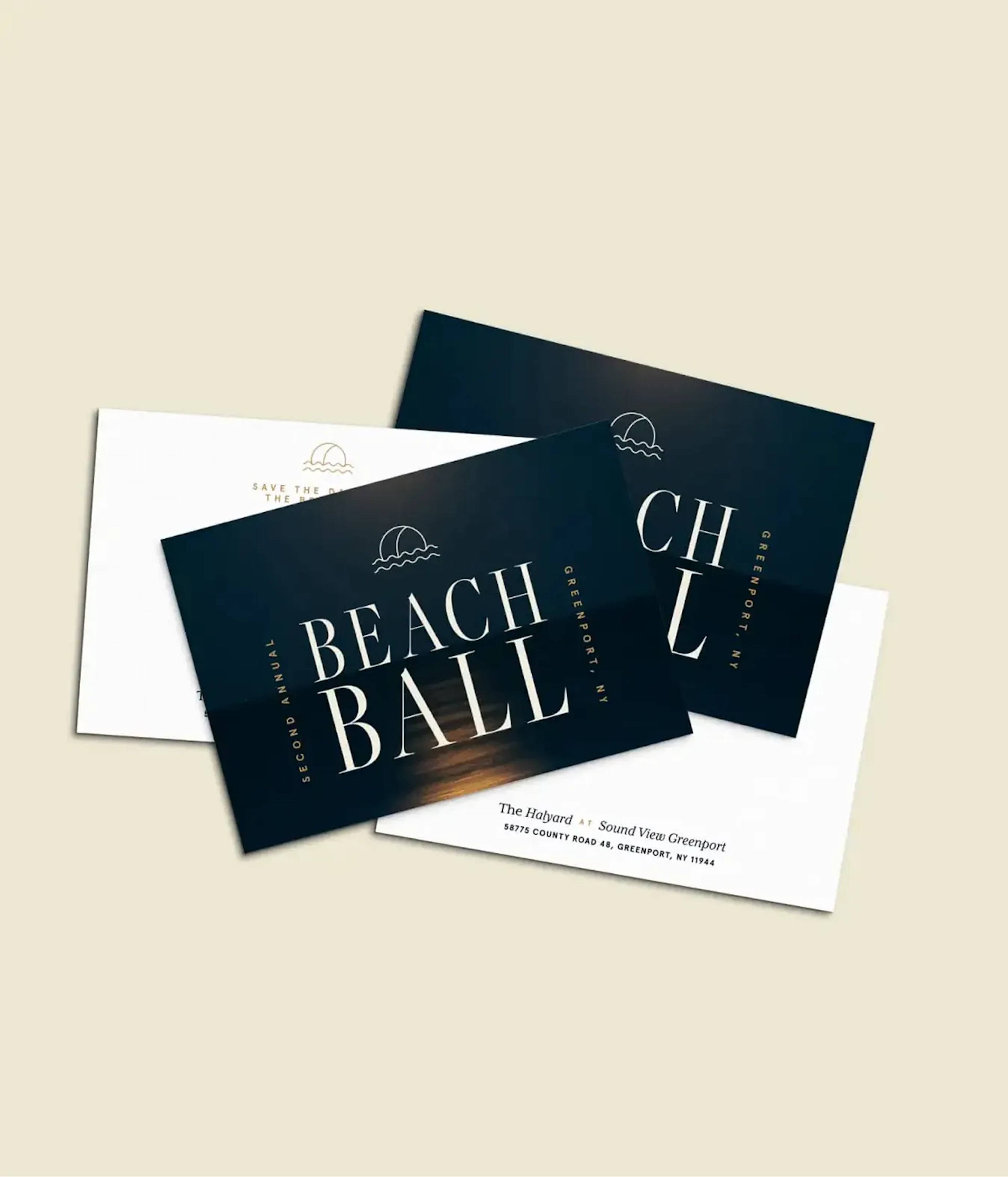 Beach Ball invitation and envelope cards fanned on a table