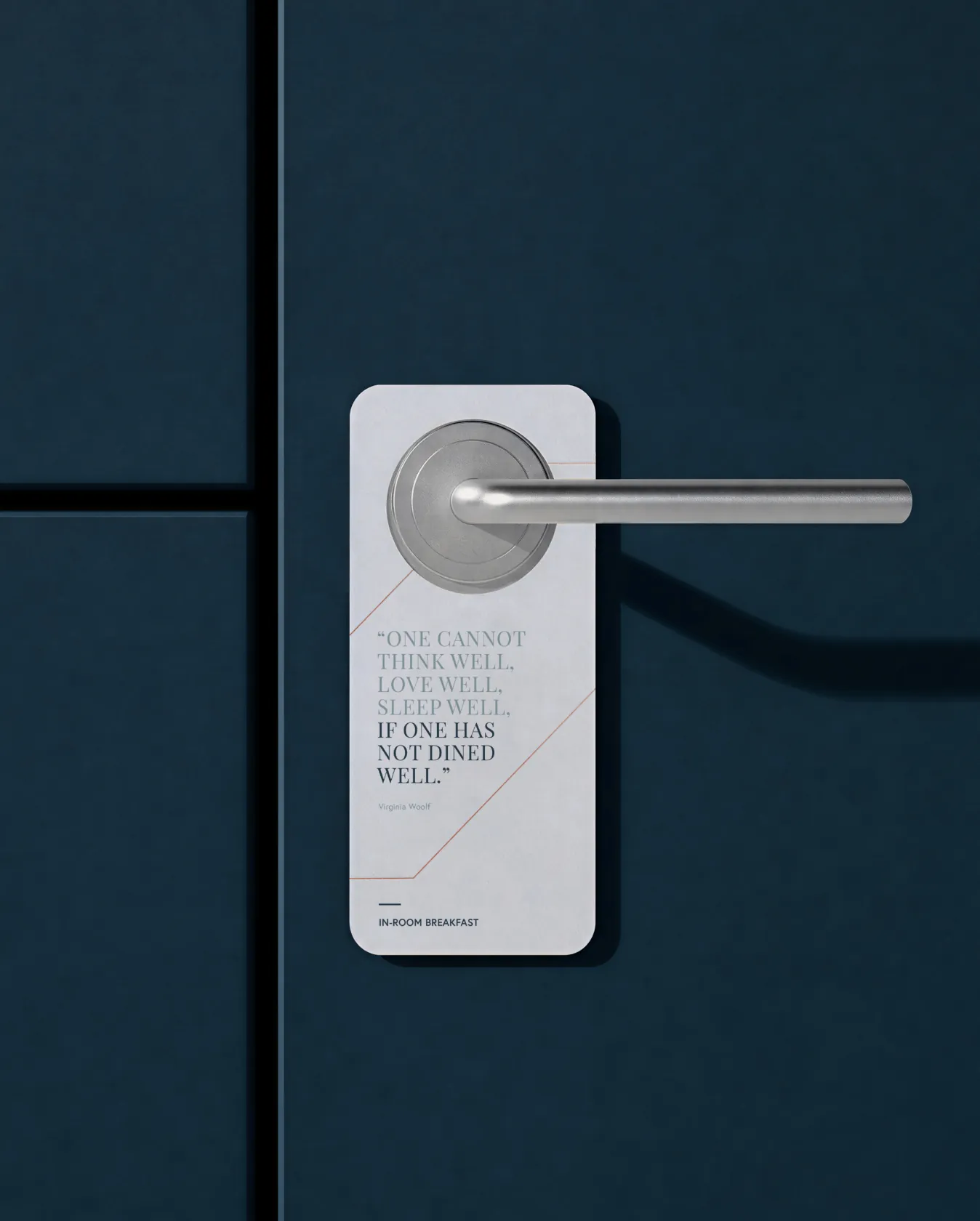 Door hanger with quote on a dark blue door beside the handle