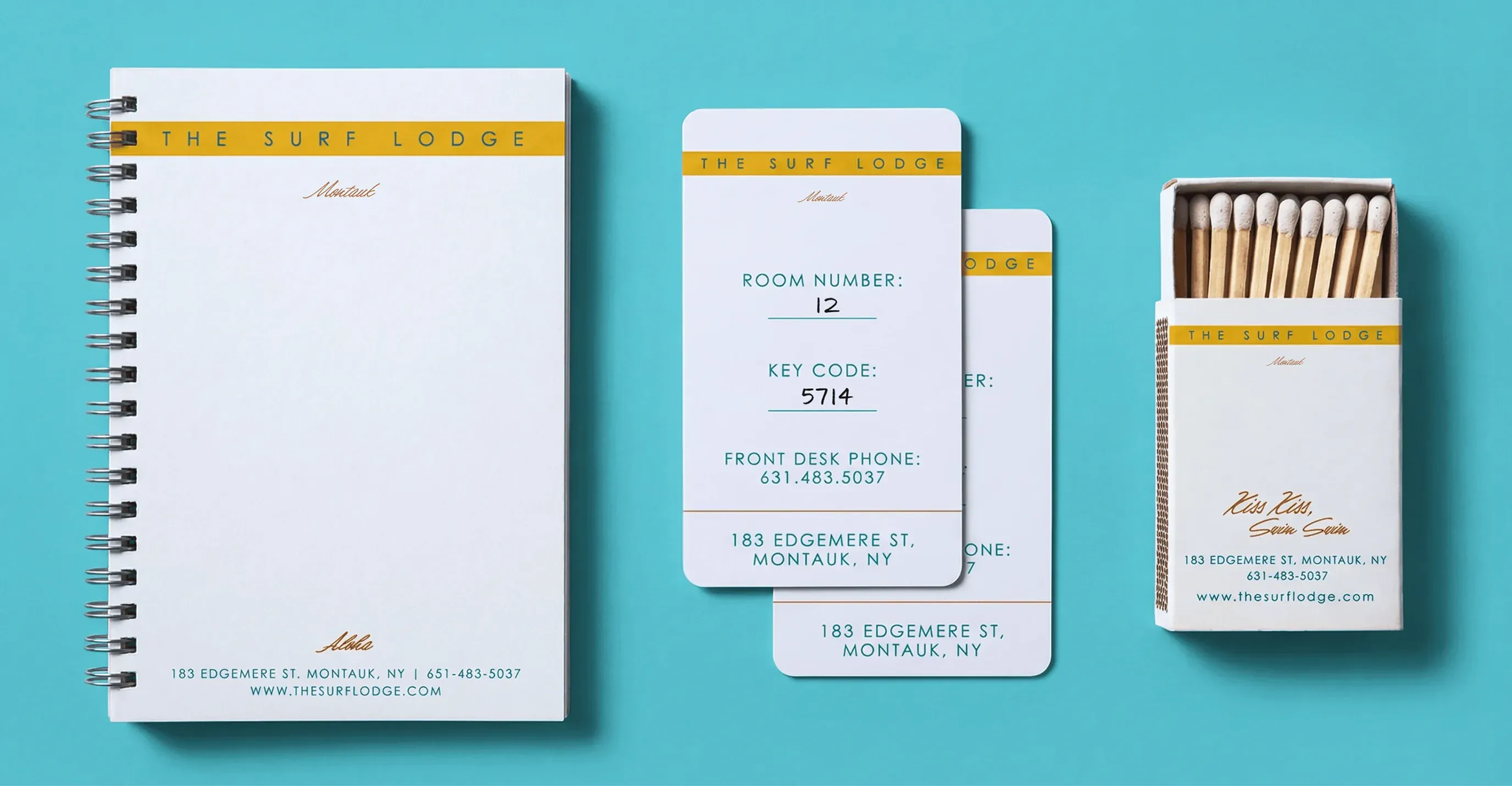 The Surf Lodge notepad, key cards, and matchbox on a blue background