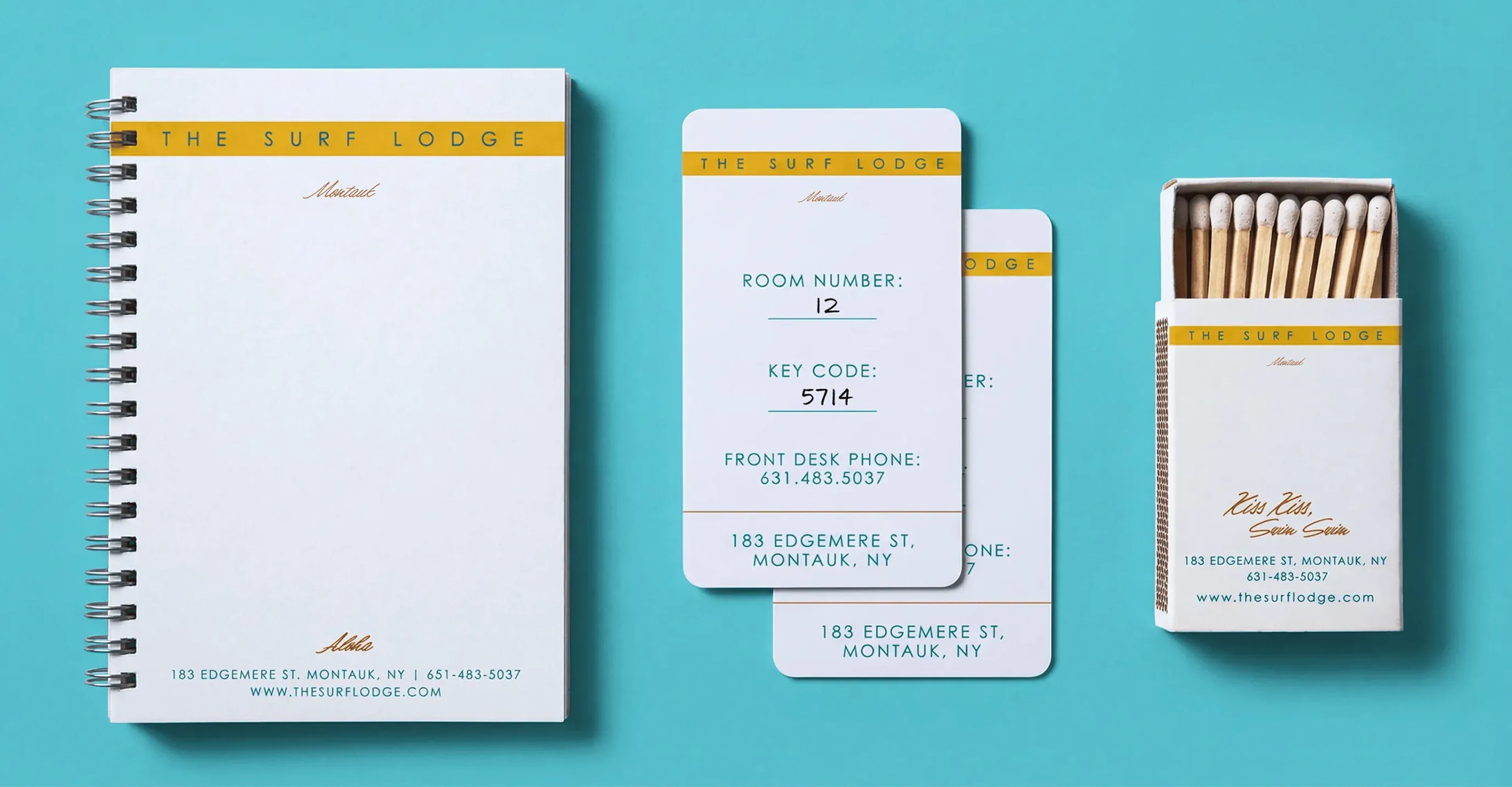 The Surf Lodge notepad, key cards, and matchbox on a blue background