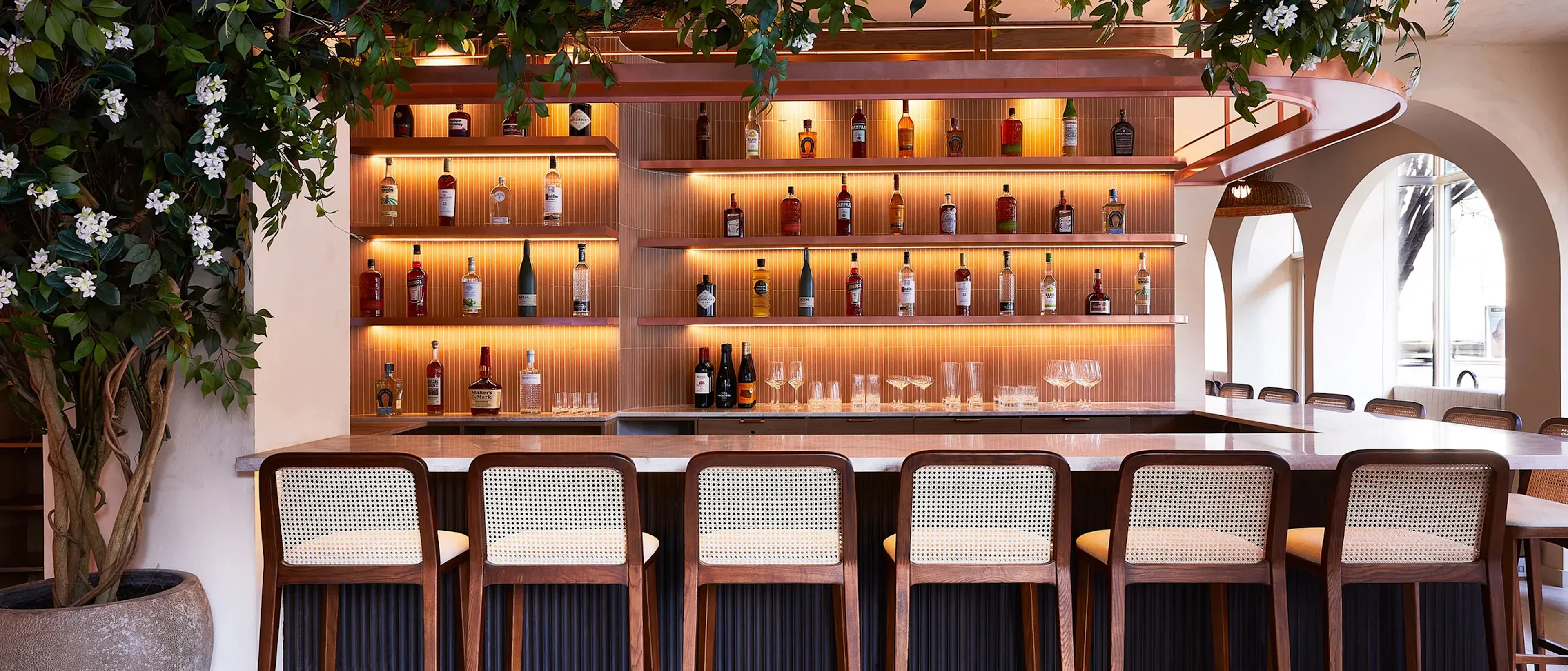 Chairs along a bar