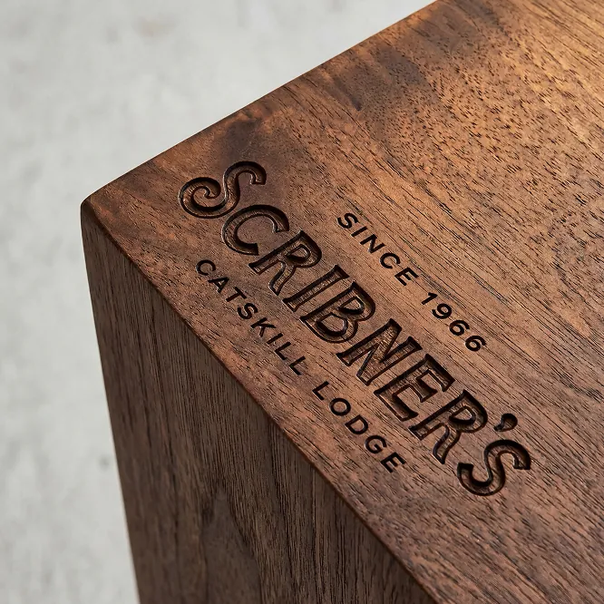 Scribner's engraved on a wooden surface