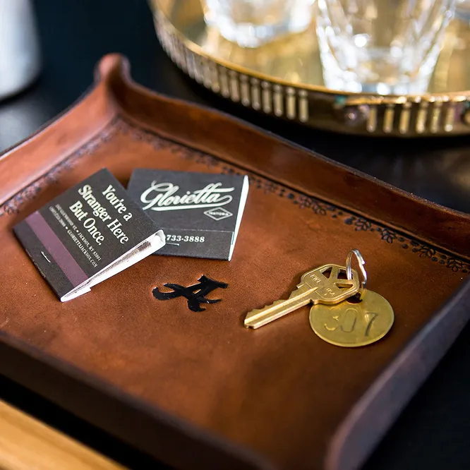 Keys and matches on a wooden tray