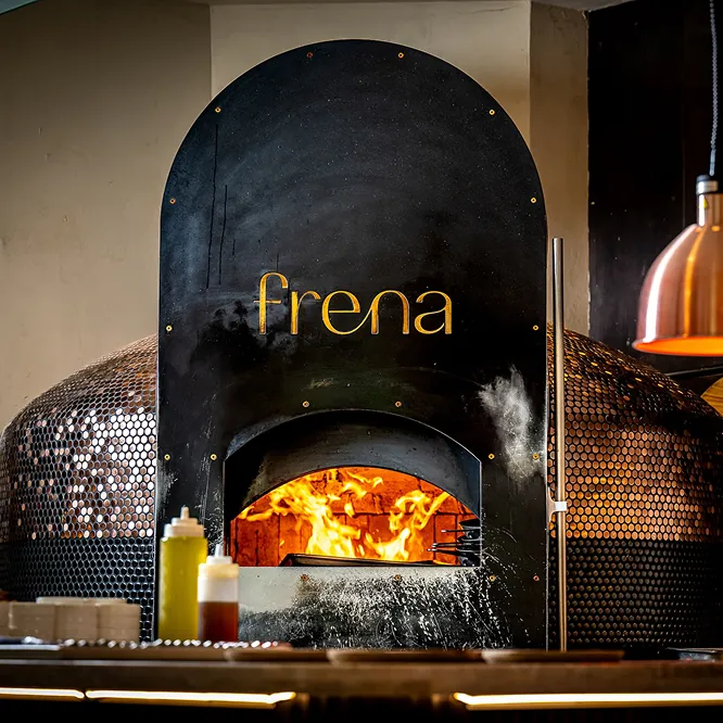 Golden logo above a wood-fire oven