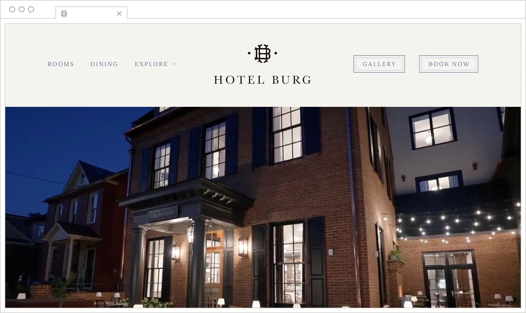 Hotel Burg website homepage mockup showing an evening exterior photo