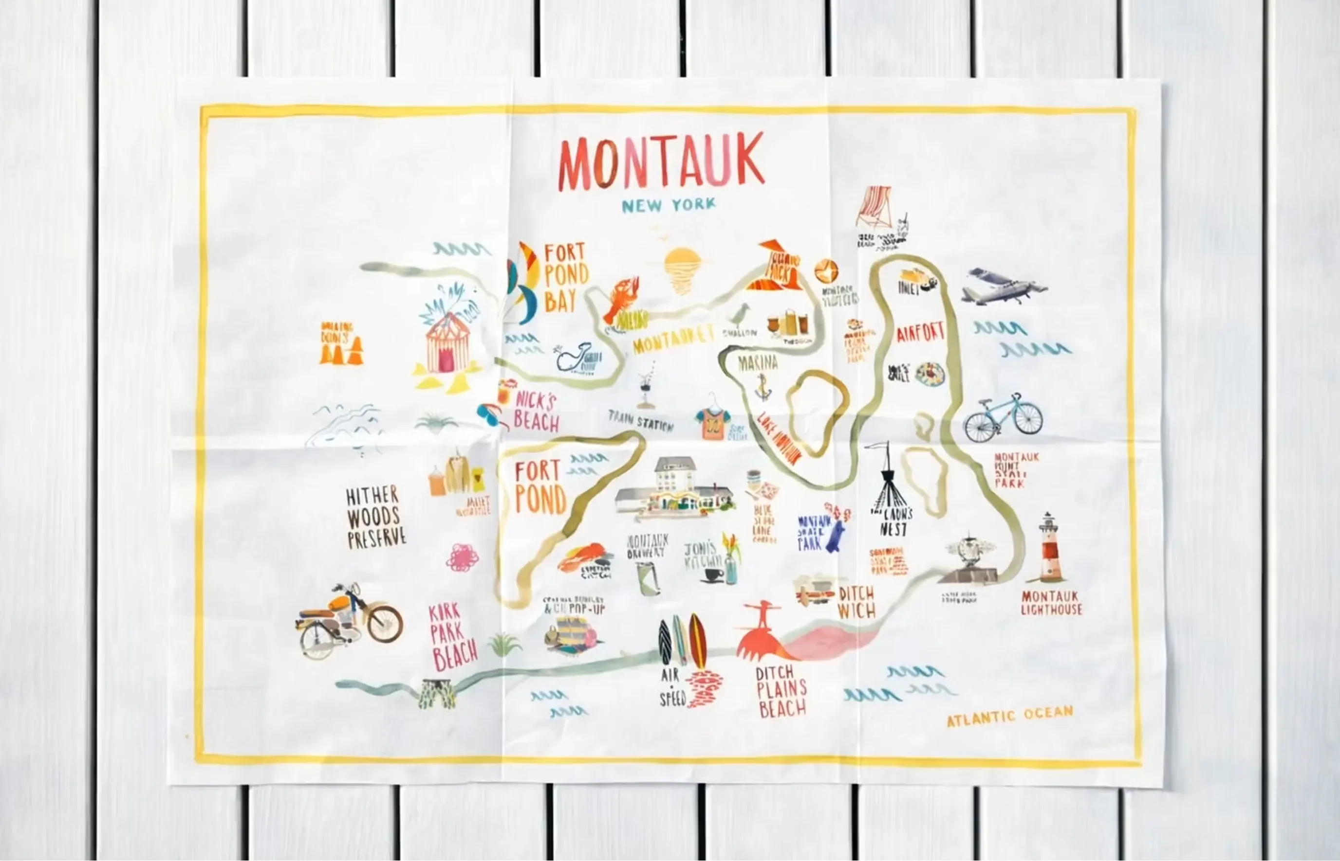 Illustrated Montauk map on a white wood surface