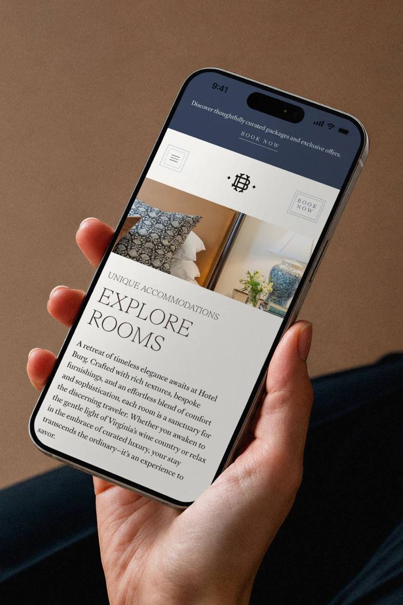 A cell phone showing Hotel Burg's explore rooms page mockup