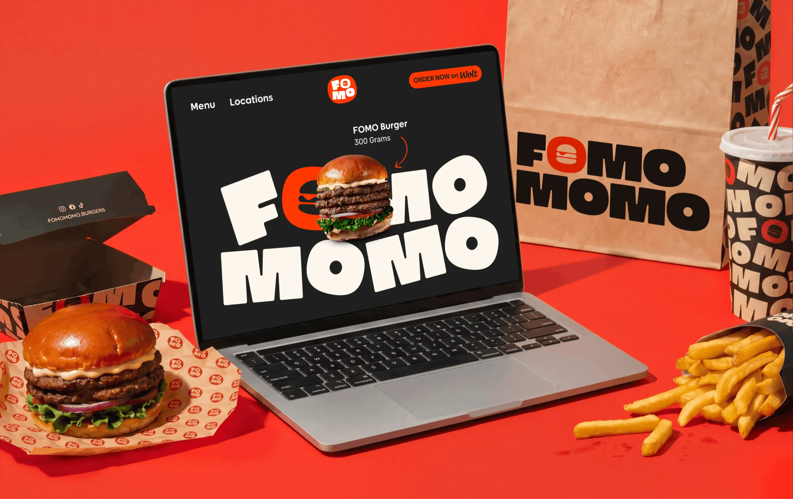 image of a laptop with the front page of the FOMO MOMO website open