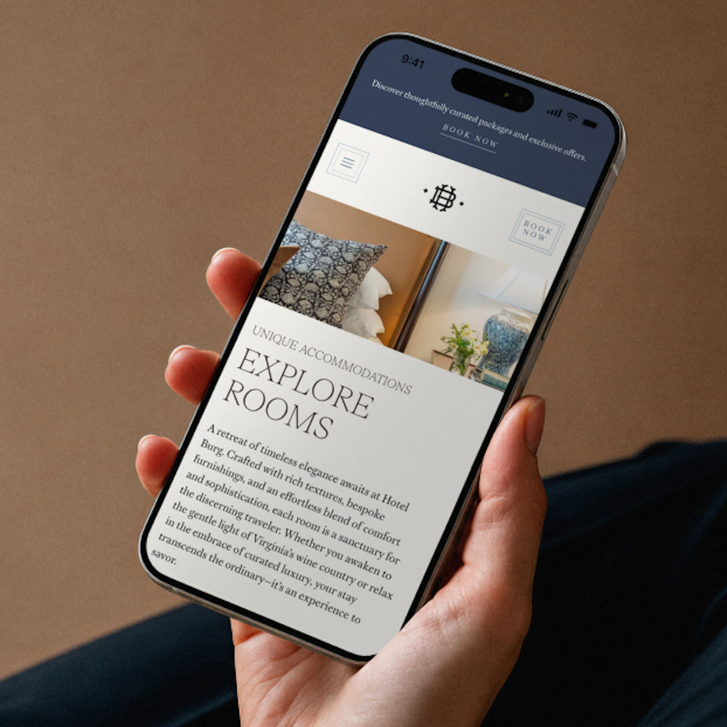 A cell phone showing Hotel Burg's explore rooms page mockup