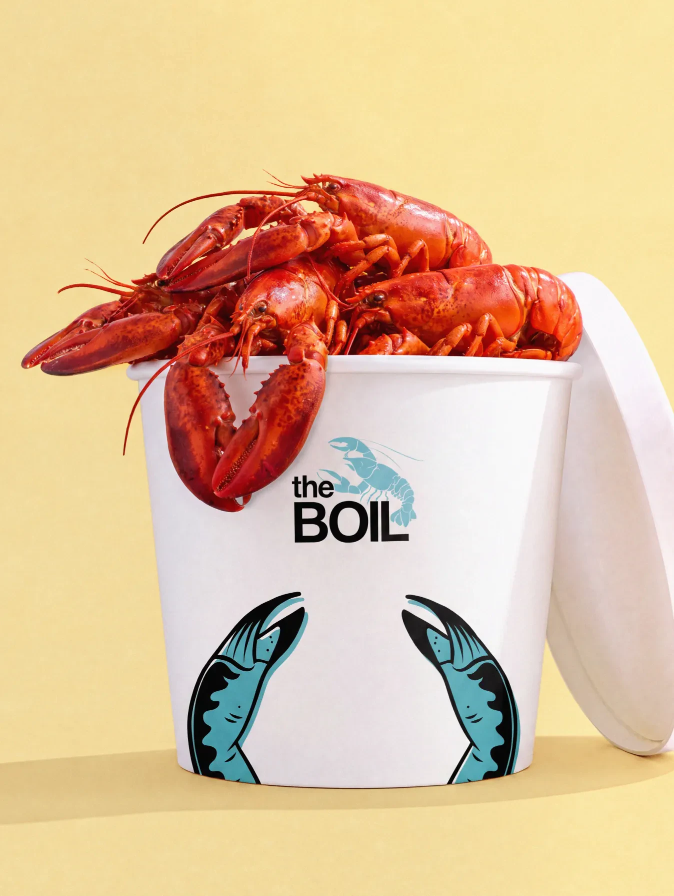 Crawfish overflowing from a theBoil takeout bucket