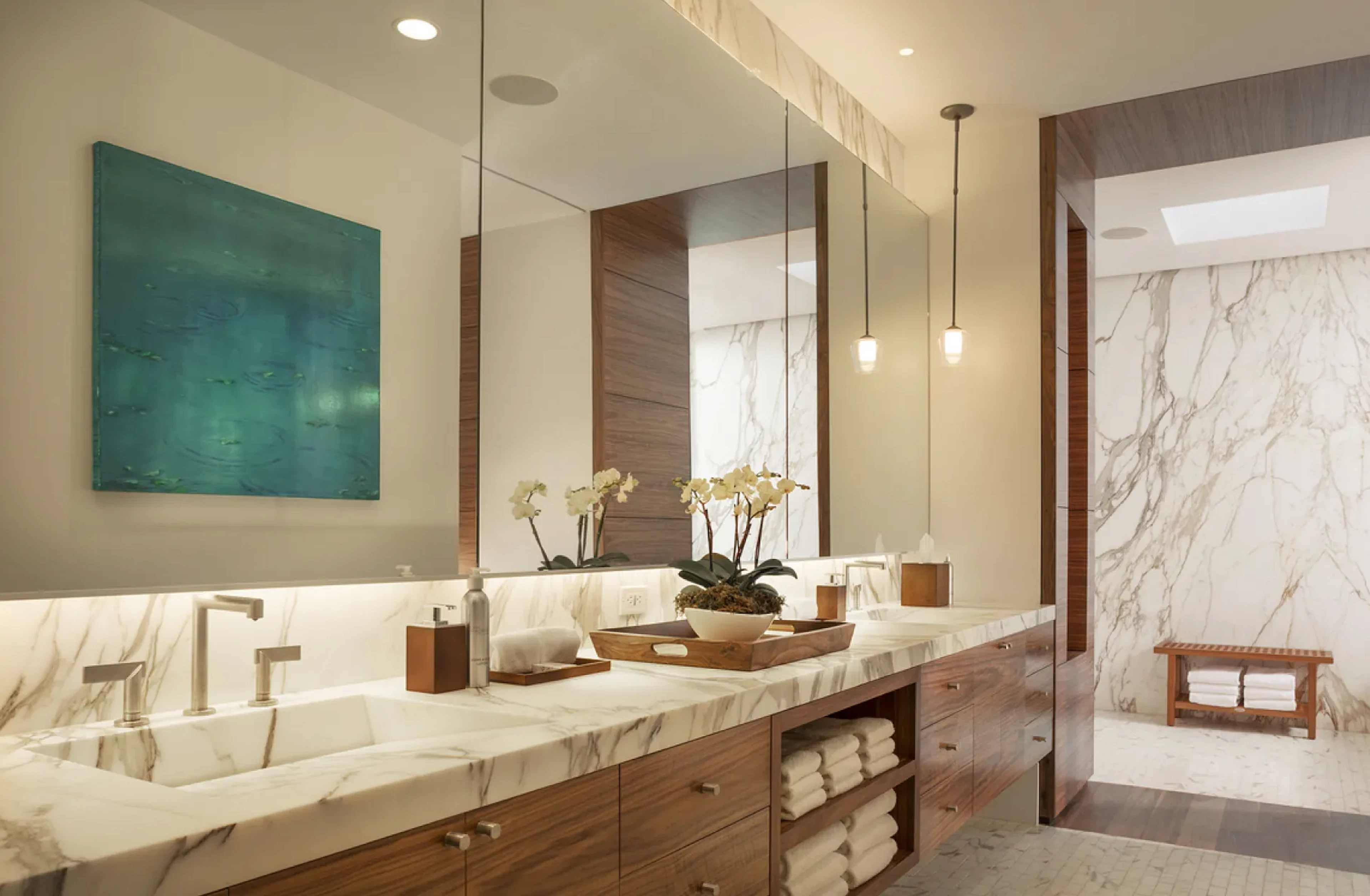 Marble double vanity bathroom with teal painting