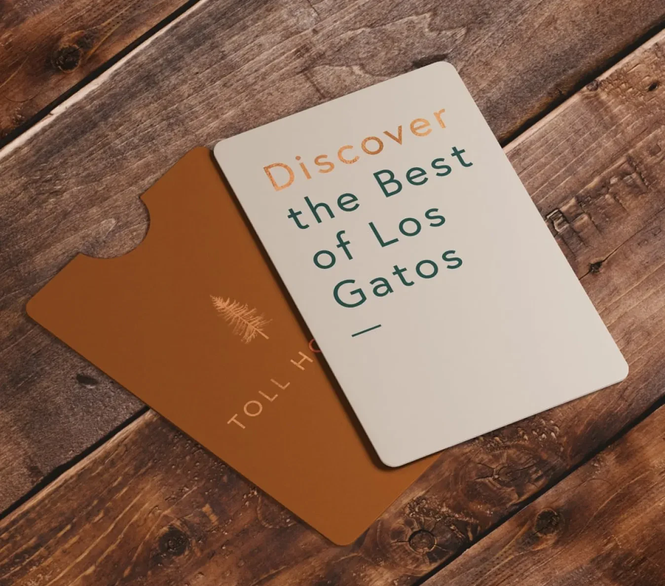 Toll House gift card and Los Gatos card on a wood table