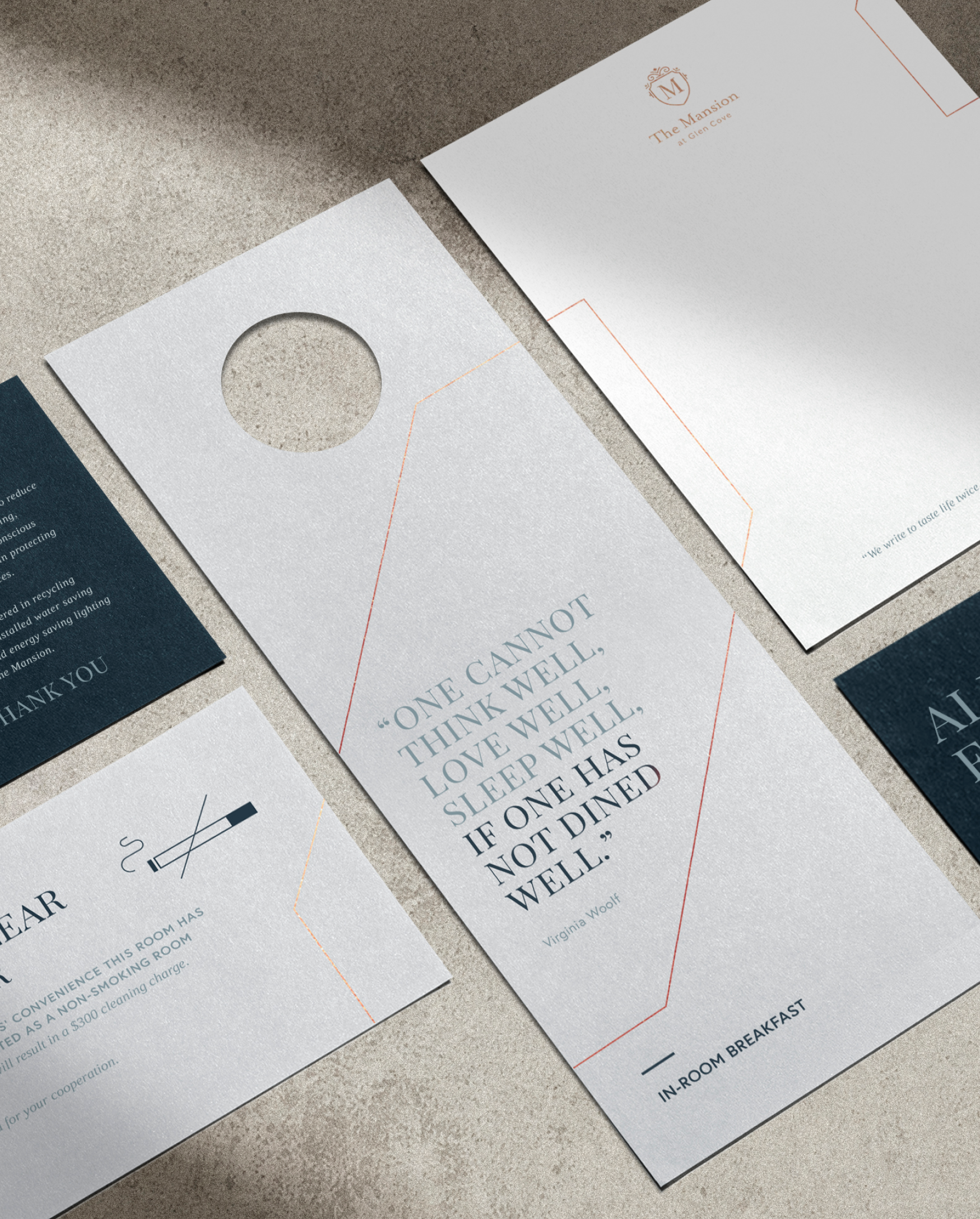 Flat lay perspective of different printed collateral for the Glen Clove Mansion including a door hanger, letterhead and coaster