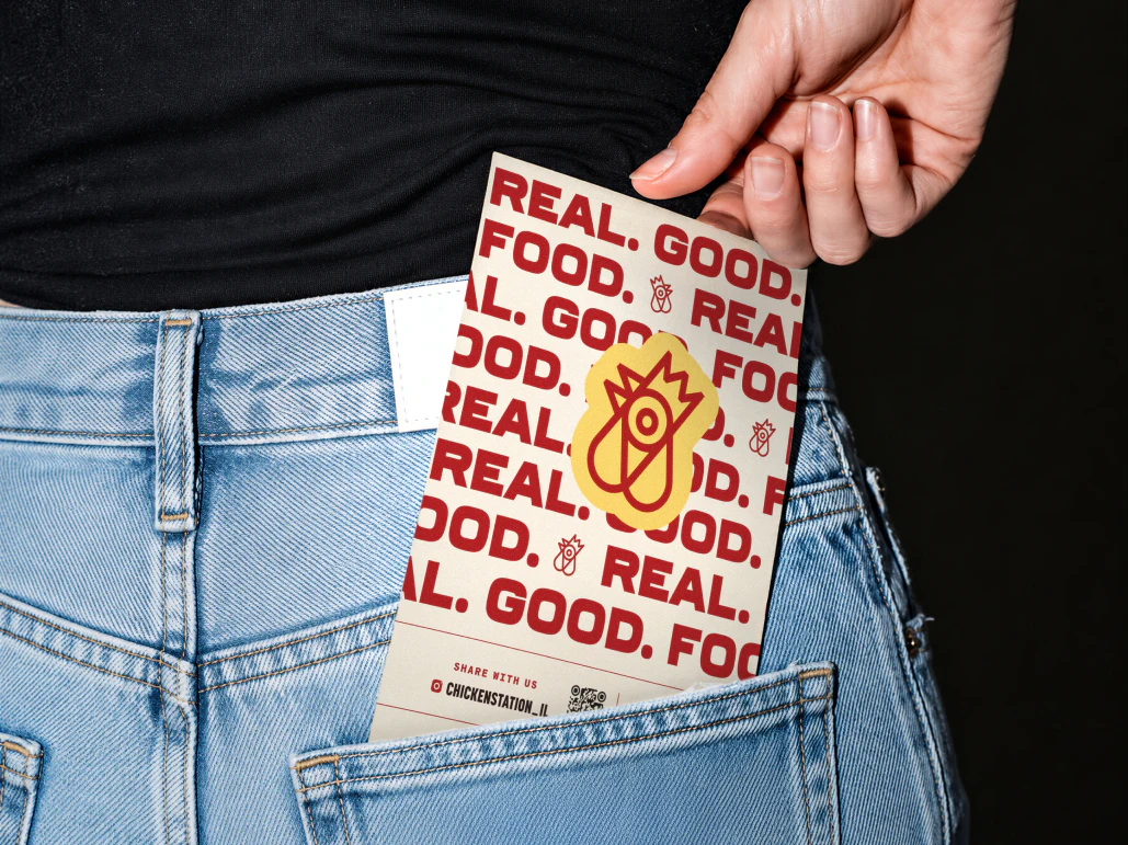 Restaurant menu in woman's back pocket of jeans