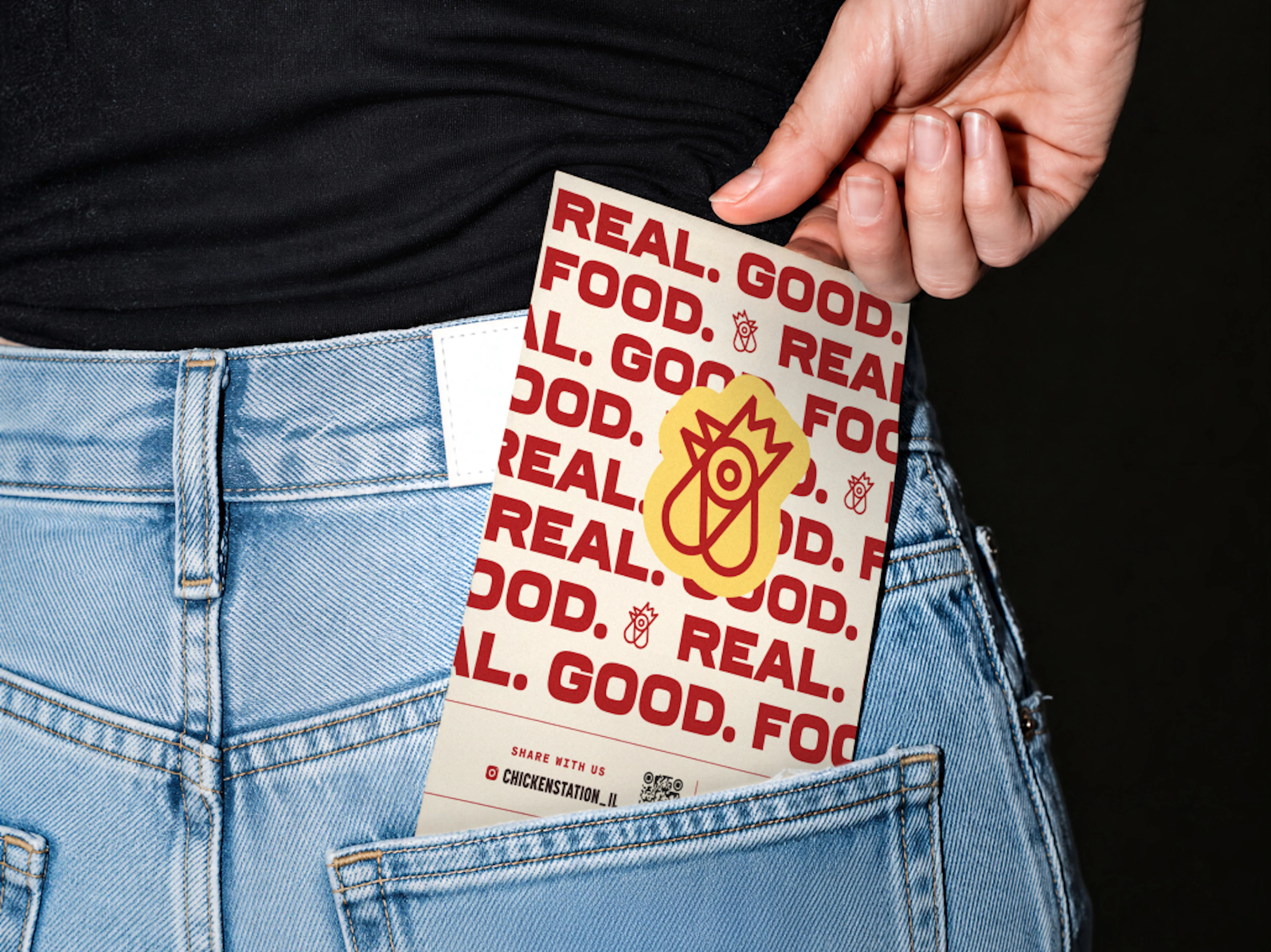 Restaurant menu in woman's back pocket of jeans