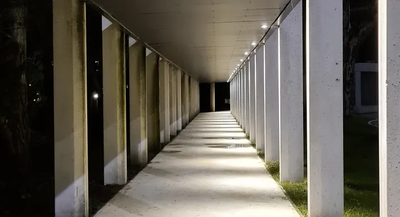 Exterior corridor, night view with low-level lighting.