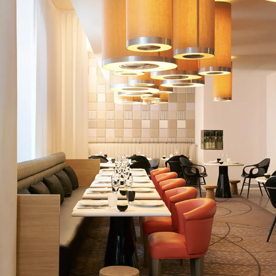 Restaurant, with chandeliers and banquette seating.