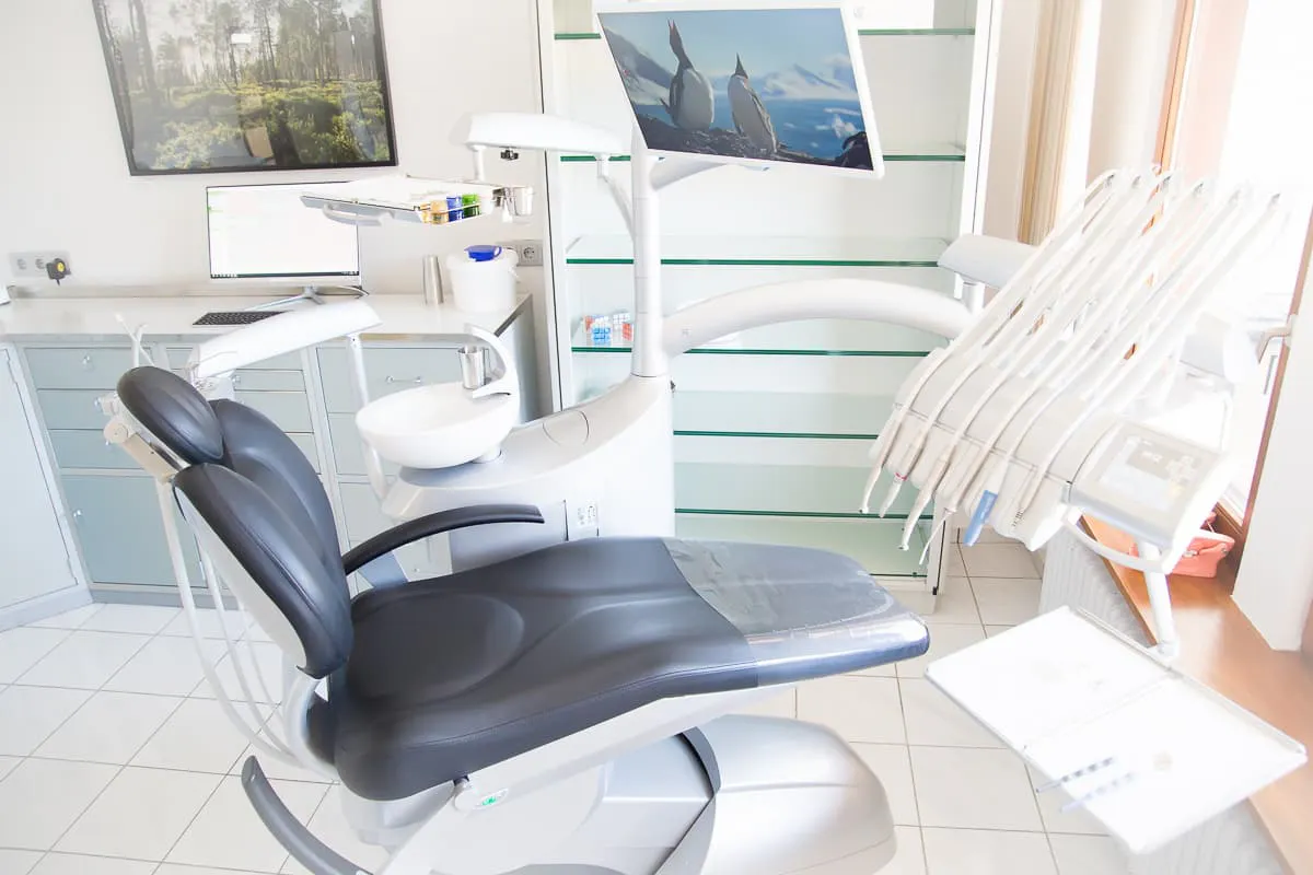 The practice's treatment room with a Black Forest picture on the wall.