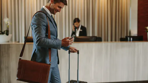 man leaves the hotel with his luggage man leaves the hotel with his luggage