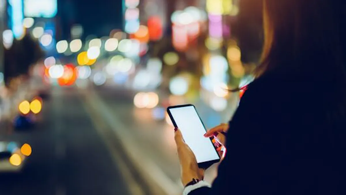 woman in the street on her phone