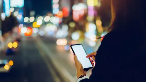 woman in the street on her phone woman in the street on her phone