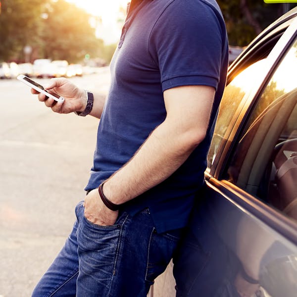 man with phone in road
