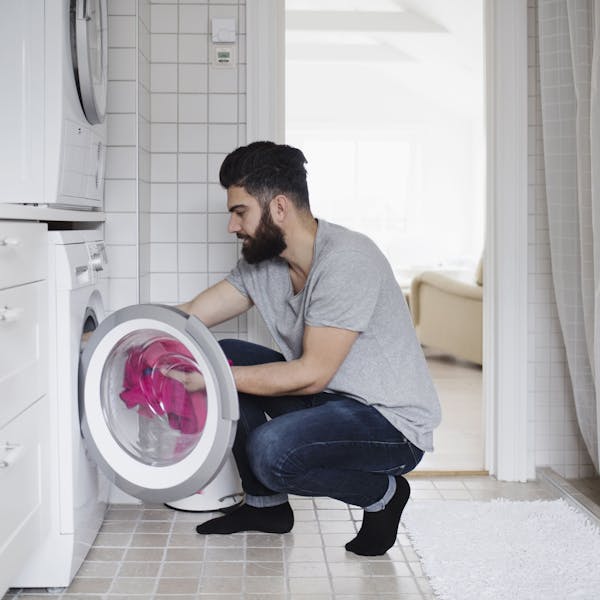 man in the laundry room