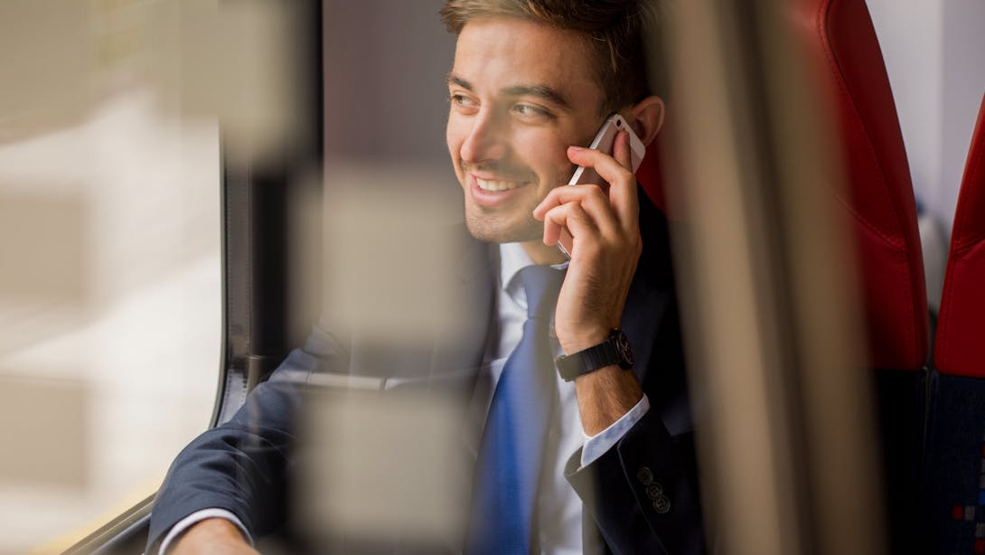 man phones in a train man phones in a train