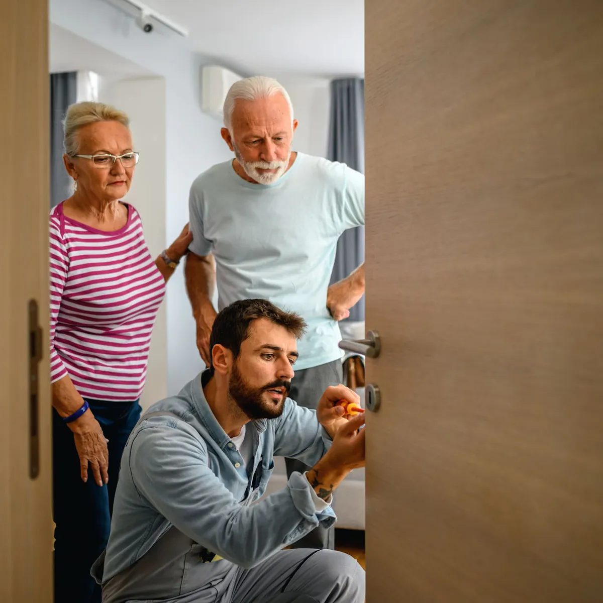 elderly couple with locksmith elderly couple with locksmith