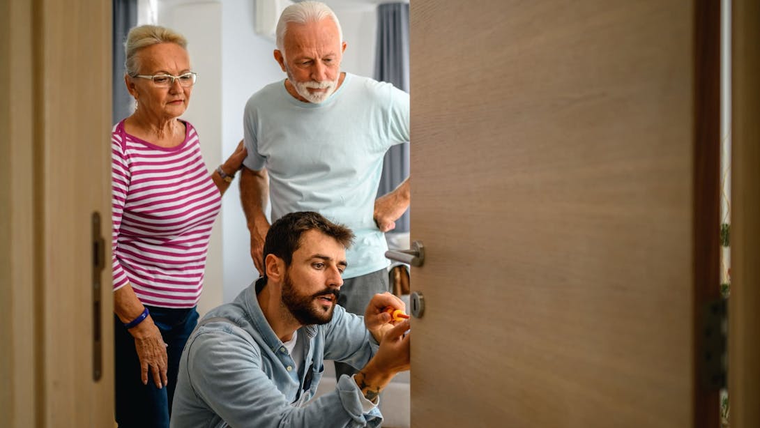 elderly couple with locksmith elderly couple with locksmith